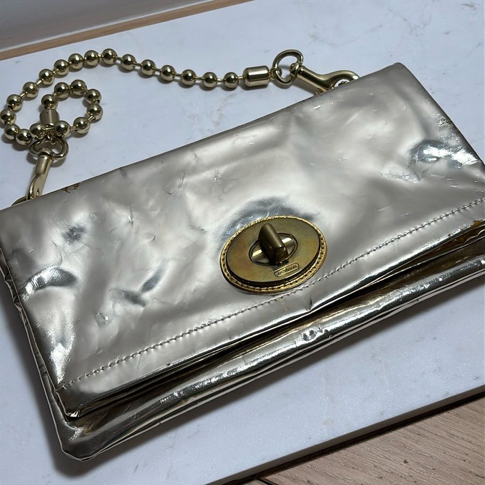 Coach clutch shiny metallic leather in distress light gold